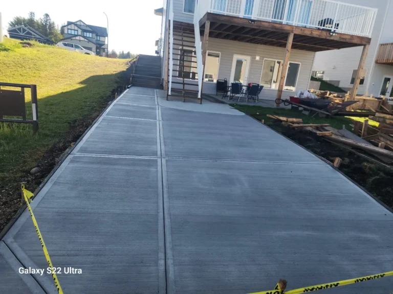 Concrete driveway and sidewalk installation Red Deer Alberta — broom finish by Gilbert Concrete
