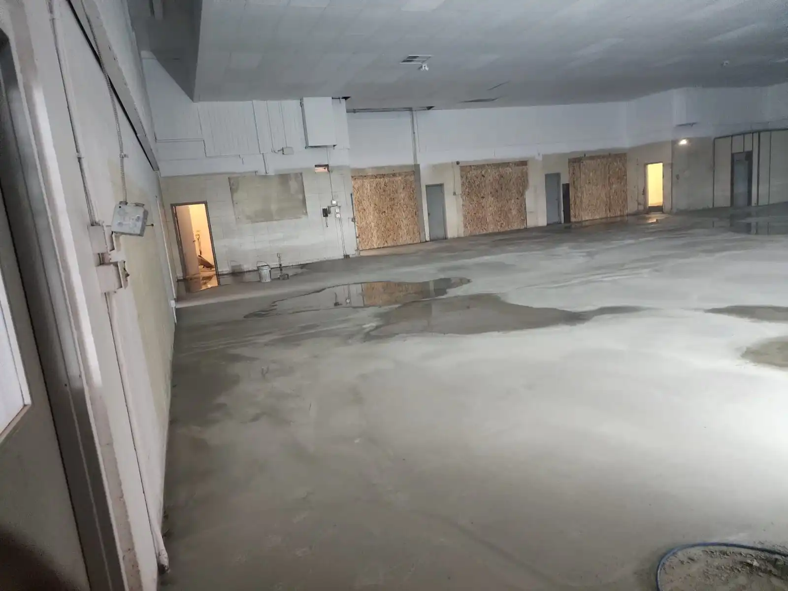 Metallic epoxy floor Red Deer showroom finish